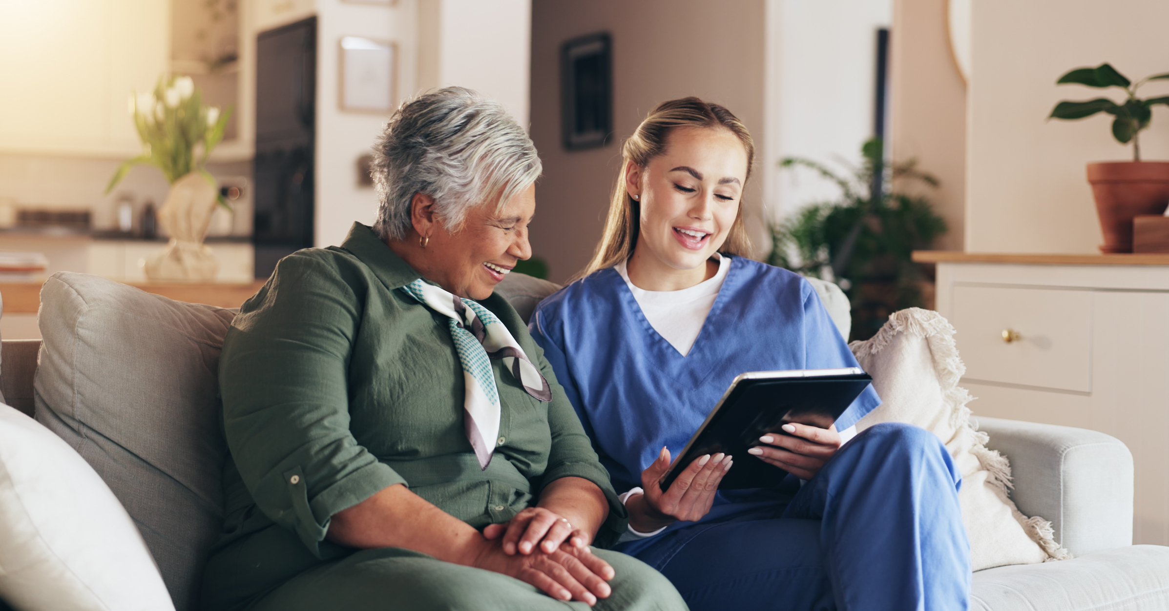 Dentist and patient looking at a tablet